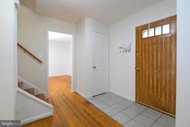 foyer with light hardwood / wood-style floors