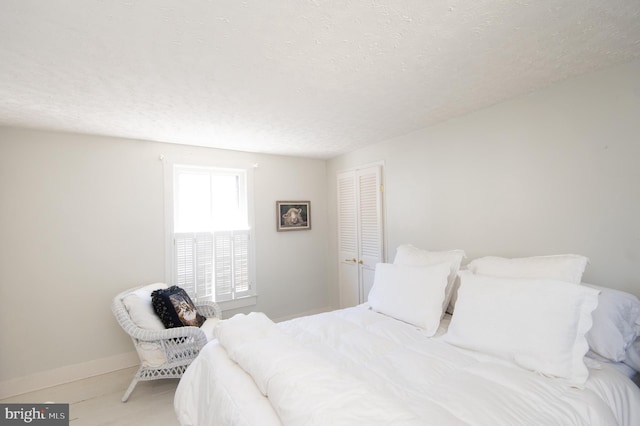 bedroom featuring a textured ceiling