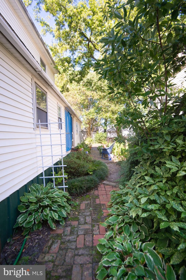 view of property exterior with a patio