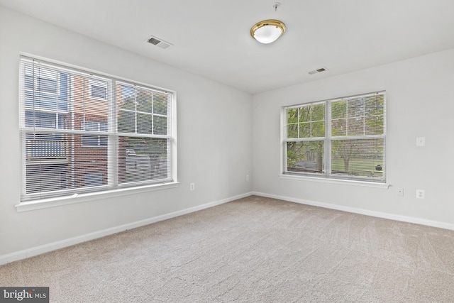 empty room featuring carpet floors