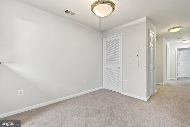 unfurnished room with light colored carpet