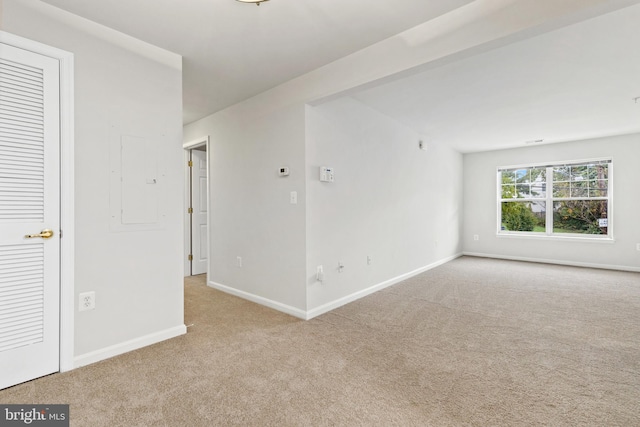 spare room with light colored carpet