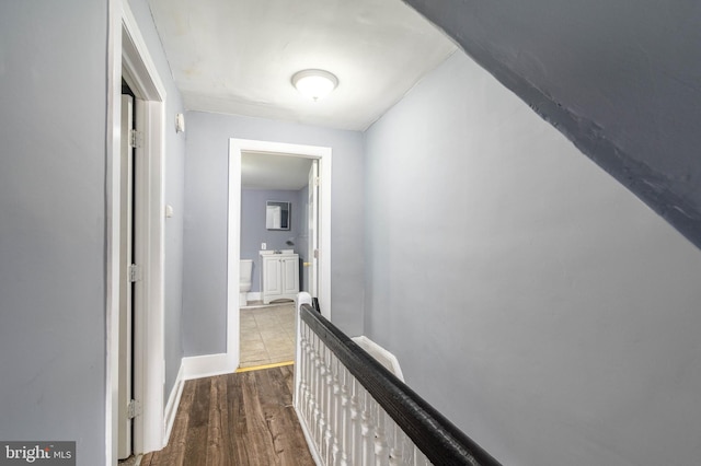 corridor with wood-type flooring