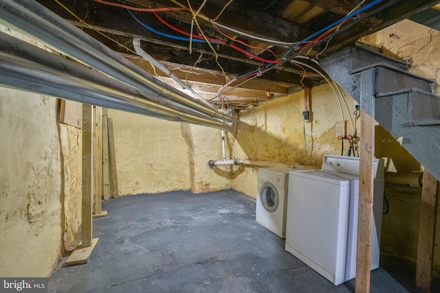 basement featuring washing machine and clothes dryer