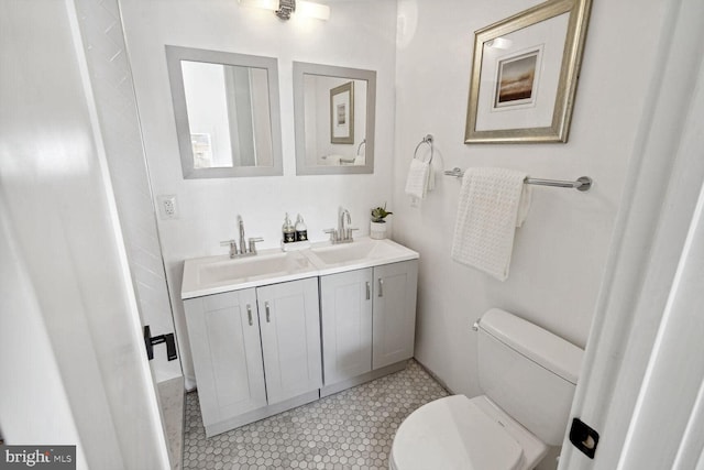 bathroom with toilet and vanity