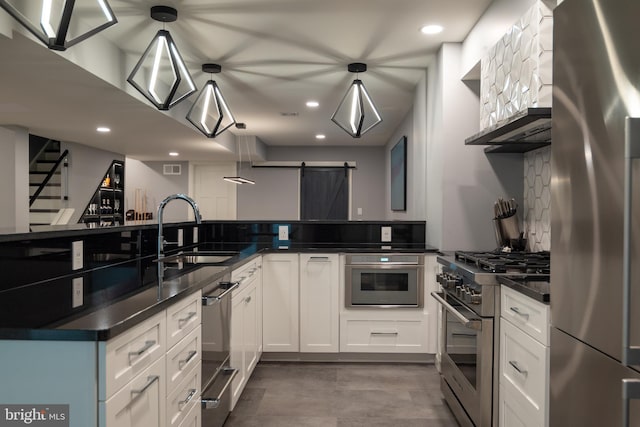 2303 Quarry Rd, Lebanon, PA 17046 - kitchen with a sink, appliances with stainless steel finishes, dark countertops, and a barn door