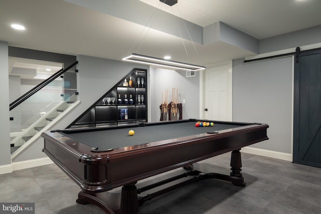 rec room with billiards and a barn door