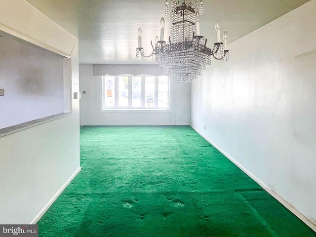 unfurnished dining area featuring a chandelier and carpet flooring