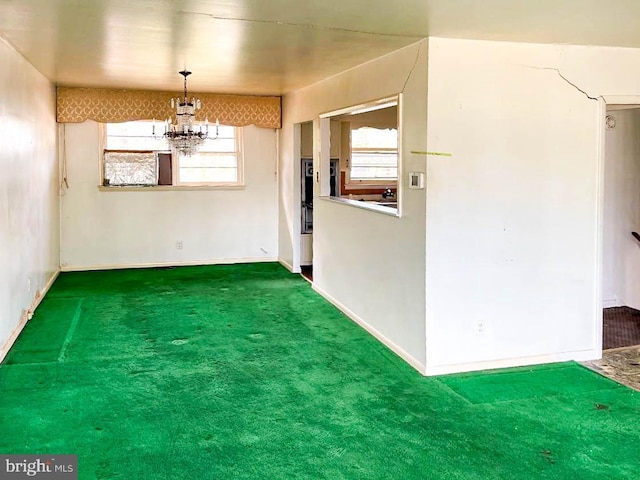 unfurnished dining area featuring an inviting chandelier and carpet