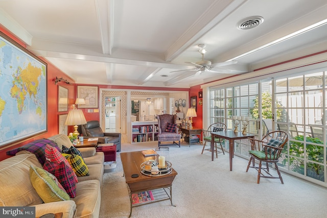 sunroom / solarium featuring ceiling fan and beam ceiling