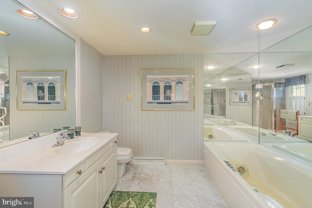 bathroom featuring vanity, a washtub, and toilet