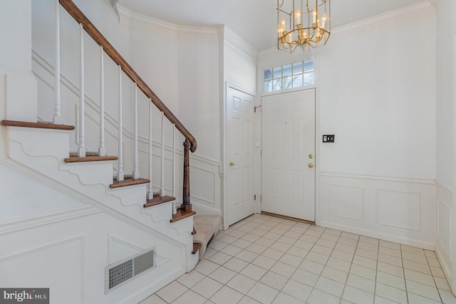 17 Kensington Sq, Mechanicsburg, PA 17050 - foyer entrance with stairs, visible vents, a chandelier, and a decorative wall