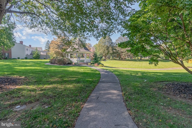 surrounding community with a gazebo and a lawn