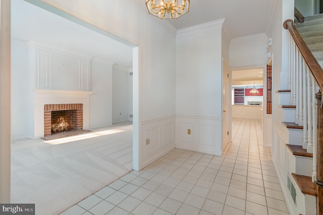 17 Kensington Sq, Mechanicsburg, PA 17050 - foyer featuring a brick fireplace, an inviting chandelier, stairway, and crown molding