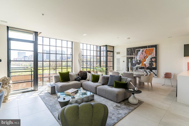 tiled living room with floor to ceiling windows