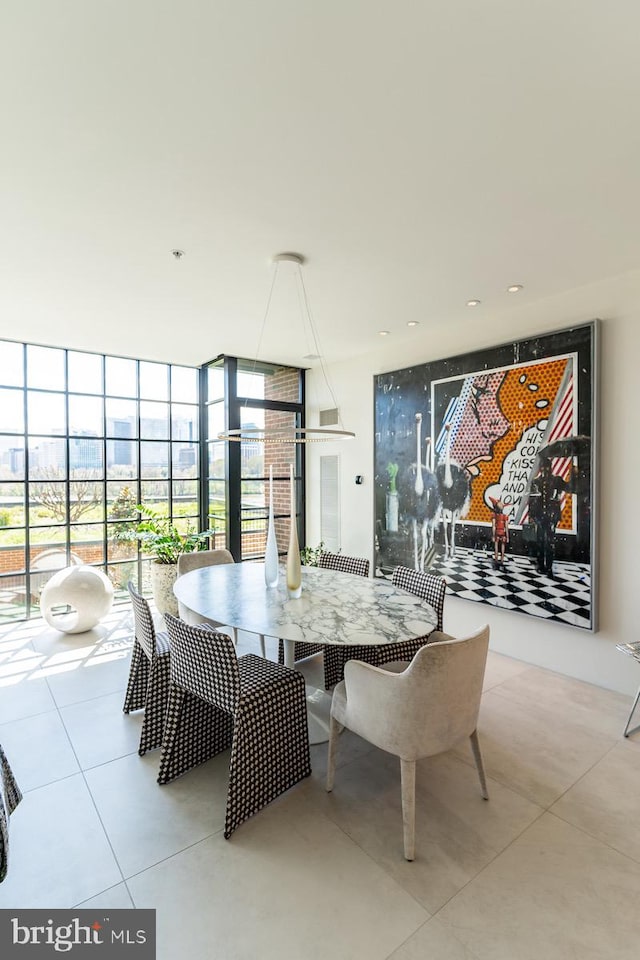 dining room featuring floor to ceiling windows