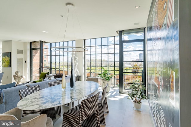 dining area featuring expansive windows