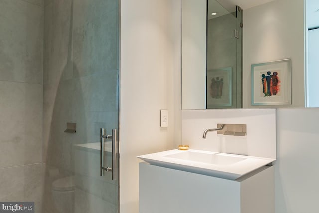 bathroom with vanity and an enclosed shower