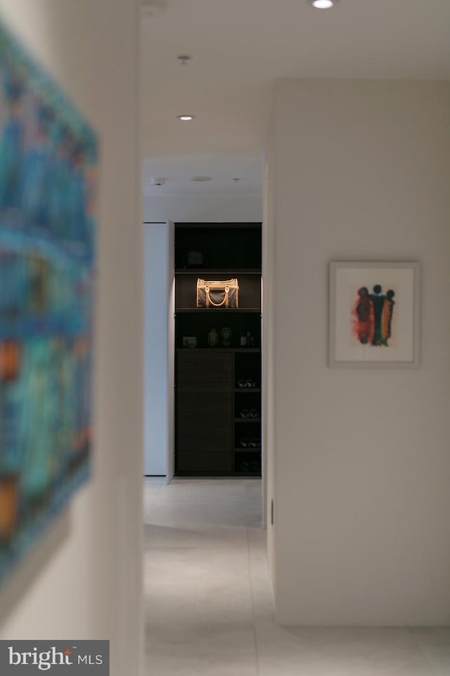 hallway featuring tile patterned floors