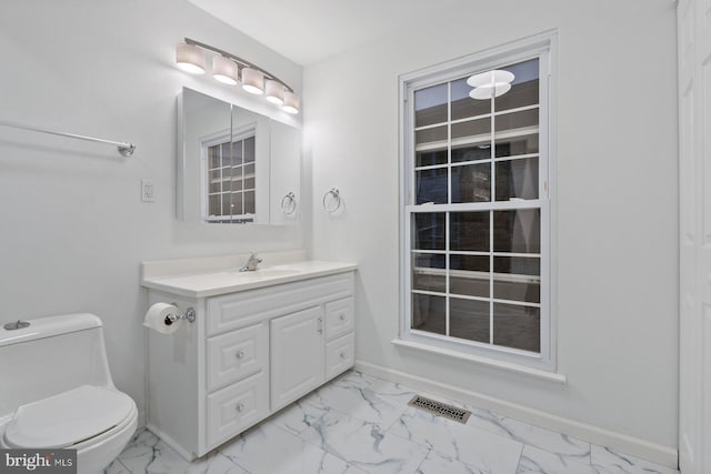 bathroom with vanity and toilet