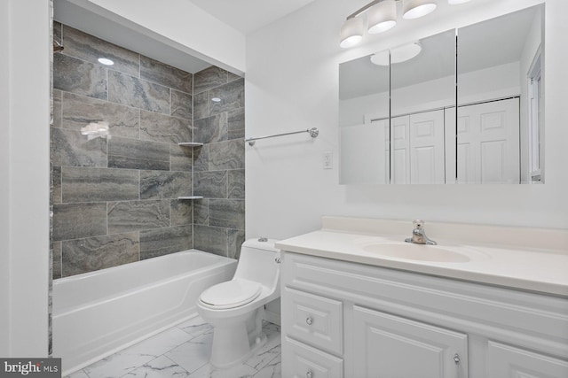 full bathroom with vanity, tiled shower / bath combo, and toilet