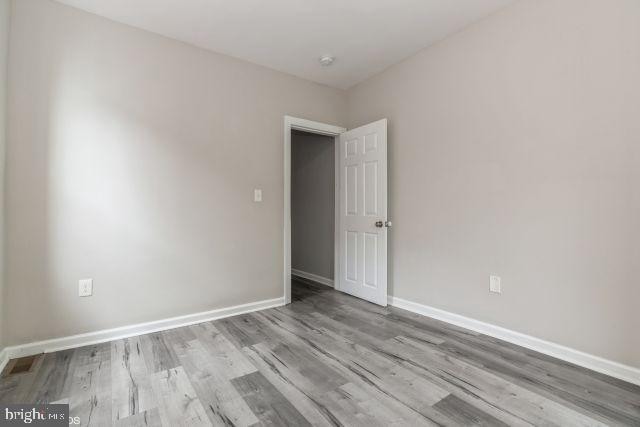 unfurnished room featuring light hardwood / wood-style flooring