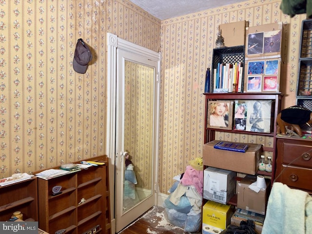 miscellaneous room with a textured ceiling