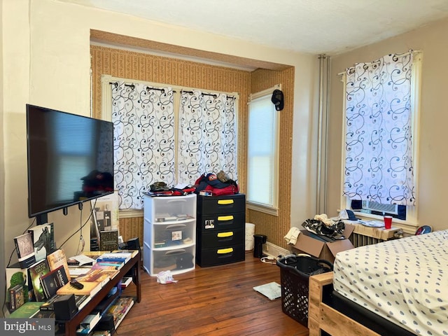 bedroom featuring dark hardwood / wood-style flooring