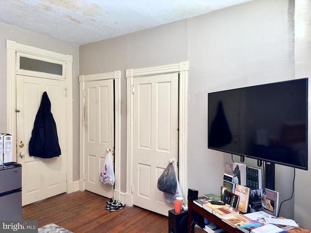 bedroom featuring dark hardwood / wood-style flooring