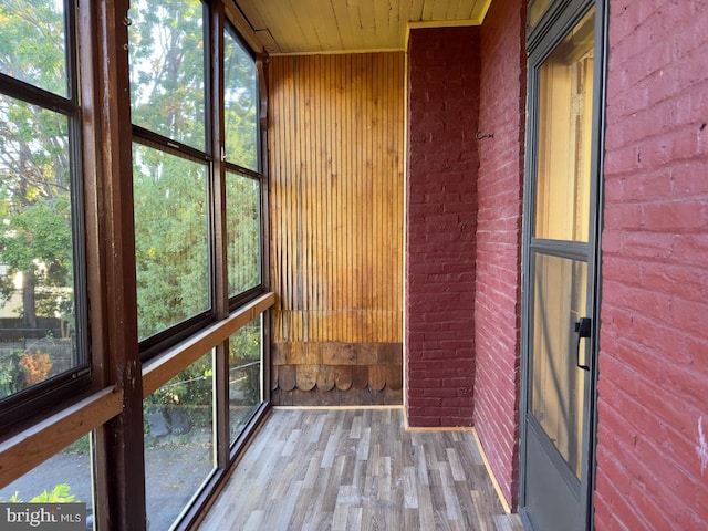 unfurnished sunroom with wooden ceiling