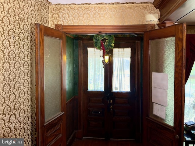 entrance foyer featuring crown molding