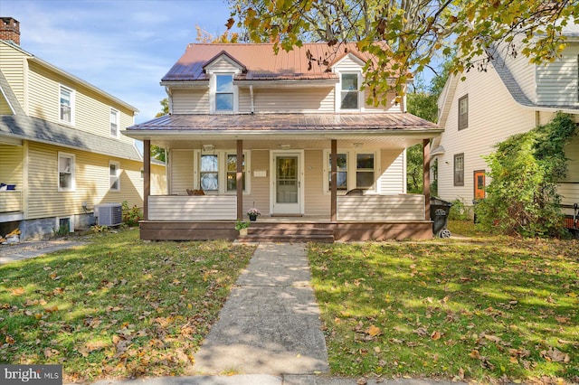 view of front of property with a porch, central AC unit, and a front lawn