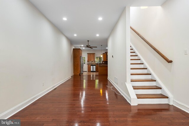 interior space with ceiling fan and wood-type flooring