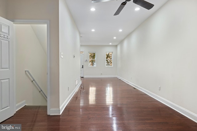 unfurnished room with dark wood-type flooring and ceiling fan