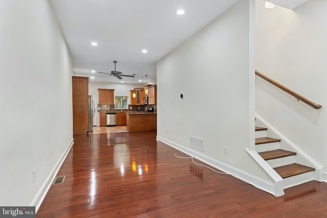 interior space with hardwood / wood-style flooring and ceiling fan