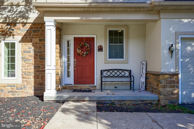 doorway to property with a porch