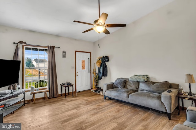 living room featuring light wood-type flooring and ceiling fan