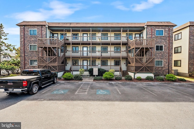 411 146th St Unit 325, Ocean City, MD 21842 - view of apartment building / complex with stairway and uncovered parking