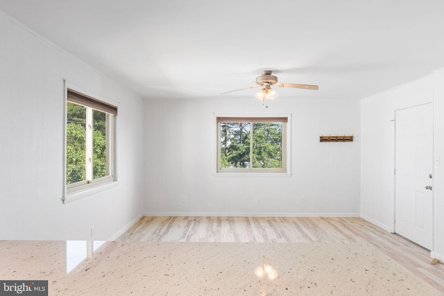 411 146th St Unit 325, Ocean City, MD 21842 - unfurnished room with plenty of natural light, wood finished floors, and a ceiling fan