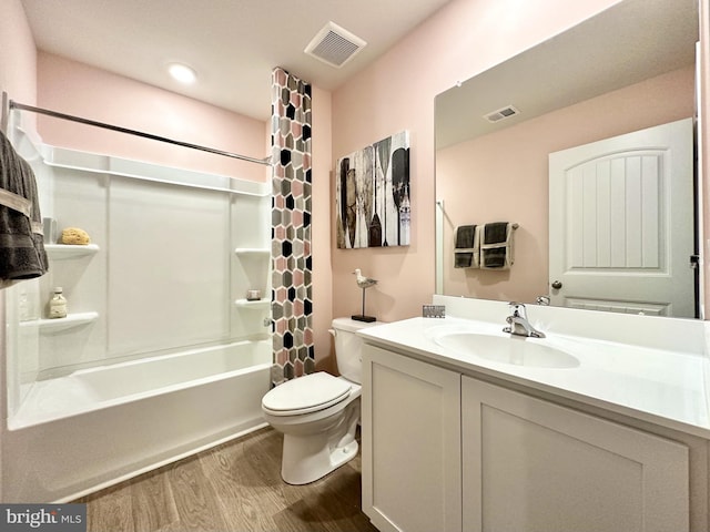 full bathroom with shower / tub combo, toilet, wood-type flooring, and vanity