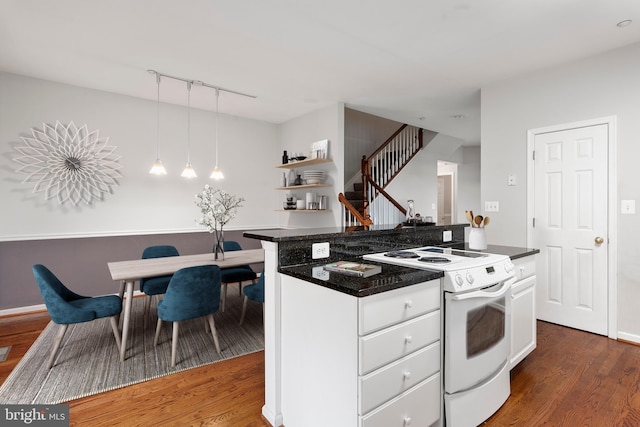 kitchen featuring dark hardwood / wood-style floors, decorative light fixtures, a kitchen island, white cabinets, and electric stove