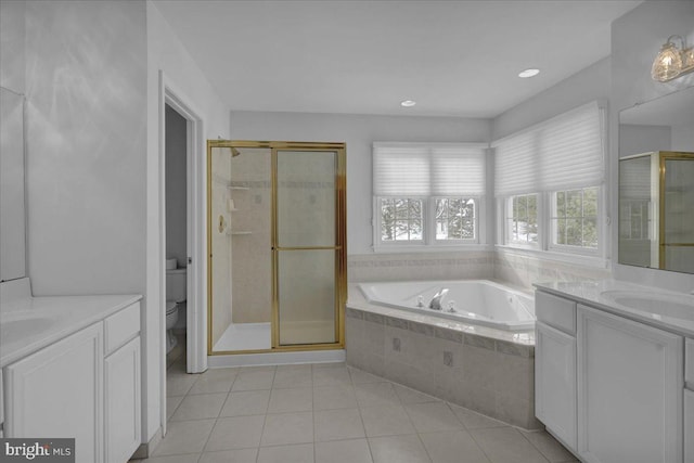 full bathroom featuring toilet, vanity, tile patterned flooring, and plus walk in shower