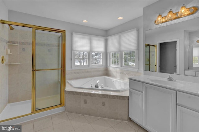 bathroom with tile patterned flooring, separate shower and tub, and vanity