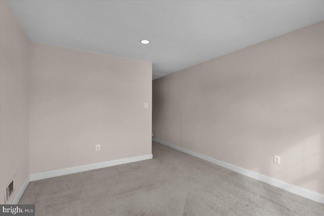 spare room with light colored carpet