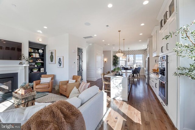 living room with dark hardwood / wood-style floors