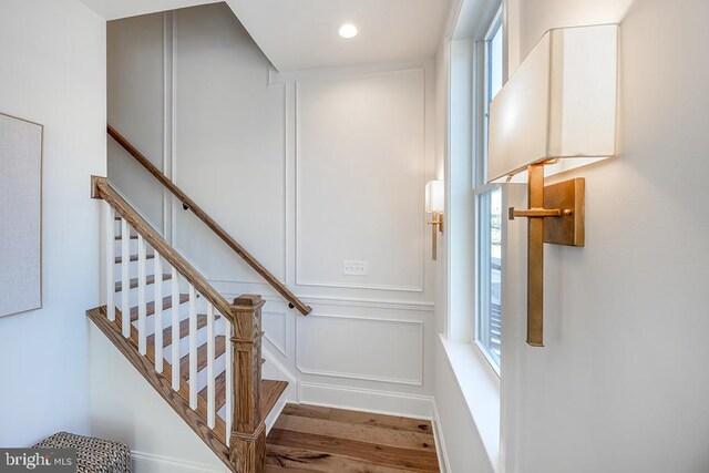 stairs with wood-type flooring