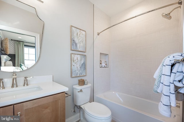 full bathroom with vanity, toilet, and tiled shower / bath combo