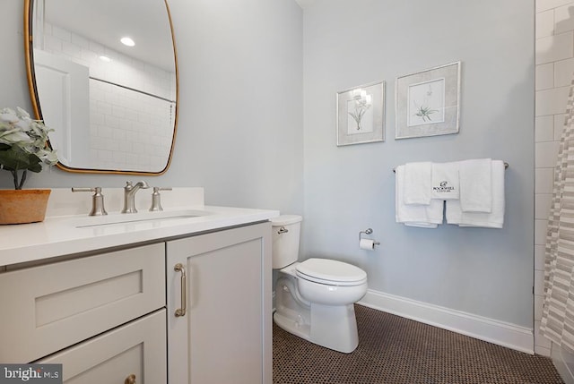 bathroom featuring vanity, toilet, and a shower with shower curtain