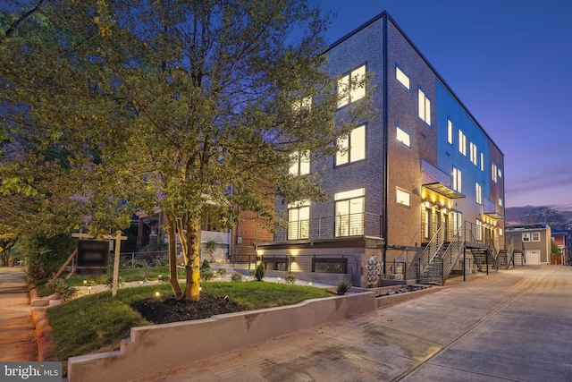 outdoor building at dusk with a garage