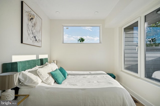 bedroom with hardwood / wood-style floors